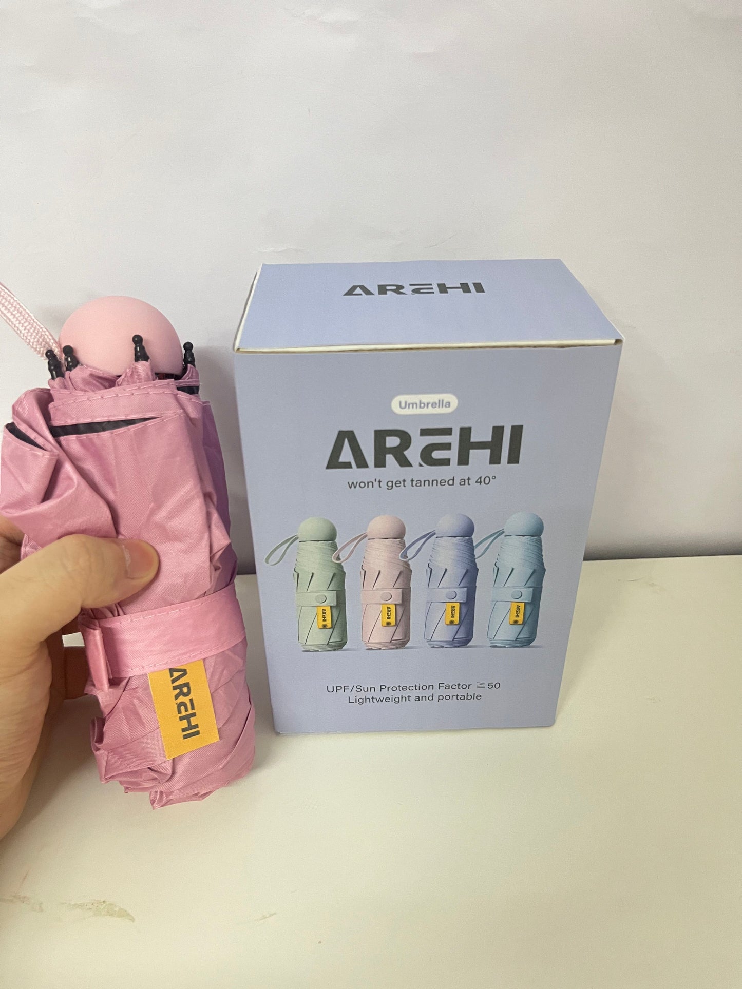 AREHI Mini Capsule Sun Protection Umbrella | UPF50+ Ultra-Light Portable Umbrella for Sun and Rain