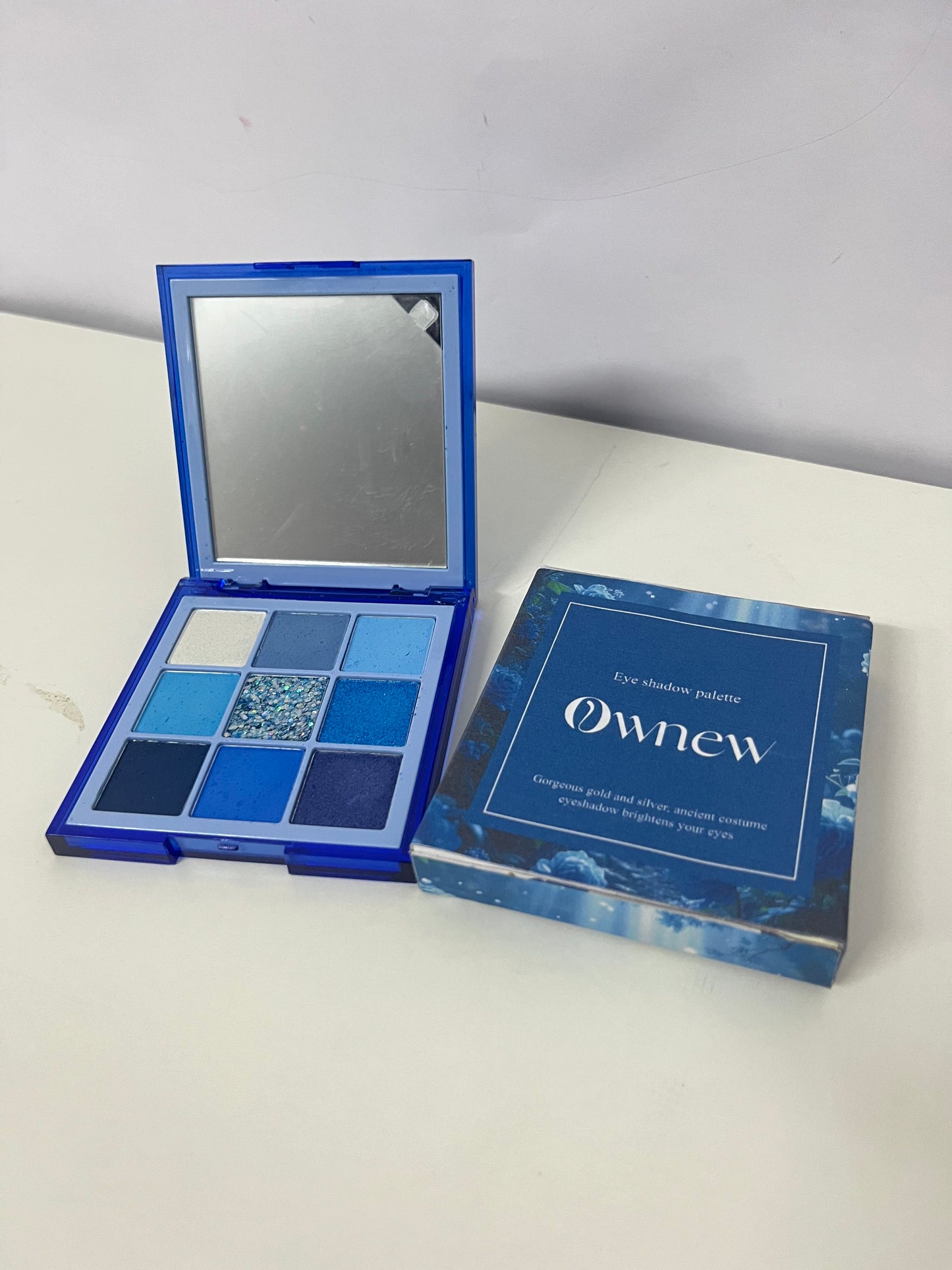 Ownew 9-Color Blue Eyeshadow Palette, Matte Shimmer Glitter Multi-Textures, Portable with Mirror, Long-Lasting Pigmented Eye Makeup Palette for Bold & Elegant Looks