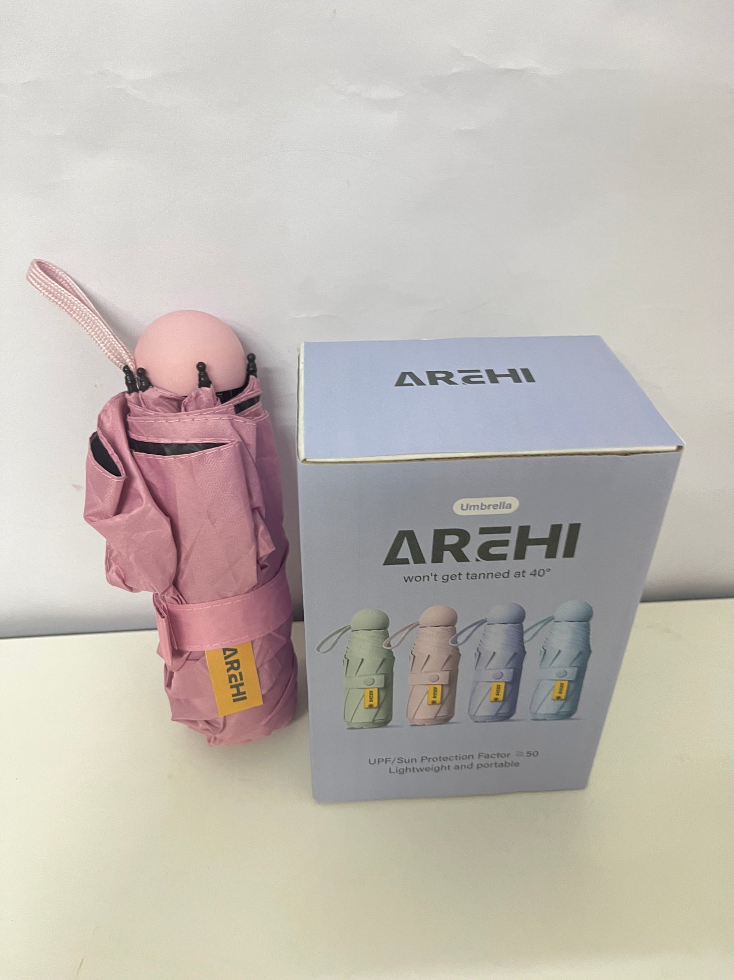 AREHI Mini Capsule Sun Protection Umbrella | UPF50+ Ultra-Light Portable Umbrella for Sun and Rain