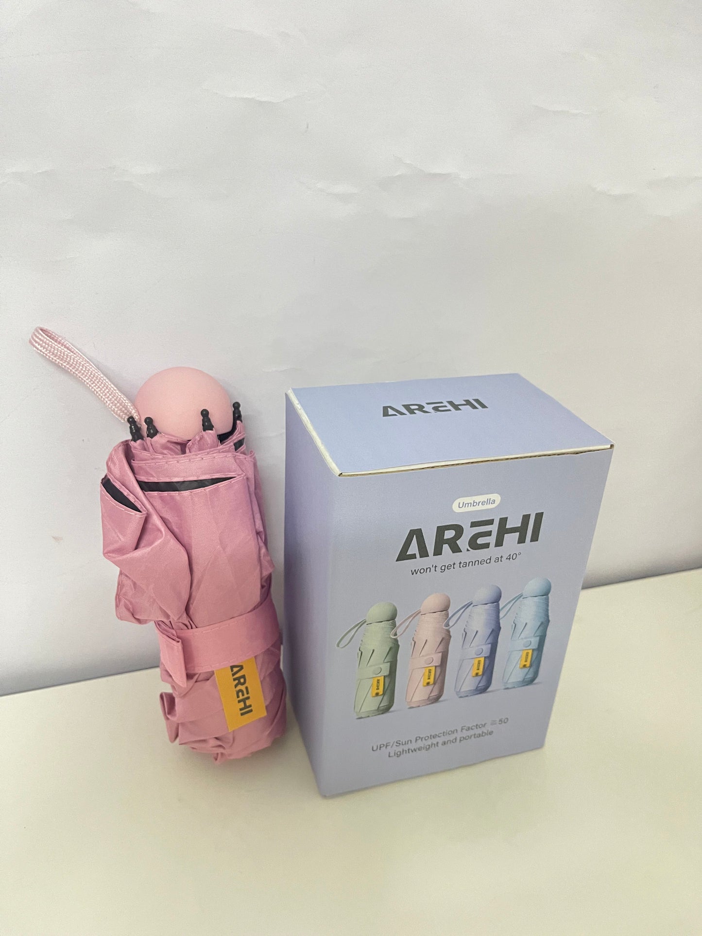 AREHI Mini Capsule Sun Protection Umbrella | UPF50+ Ultra-Light Portable Umbrella for Sun and Rain