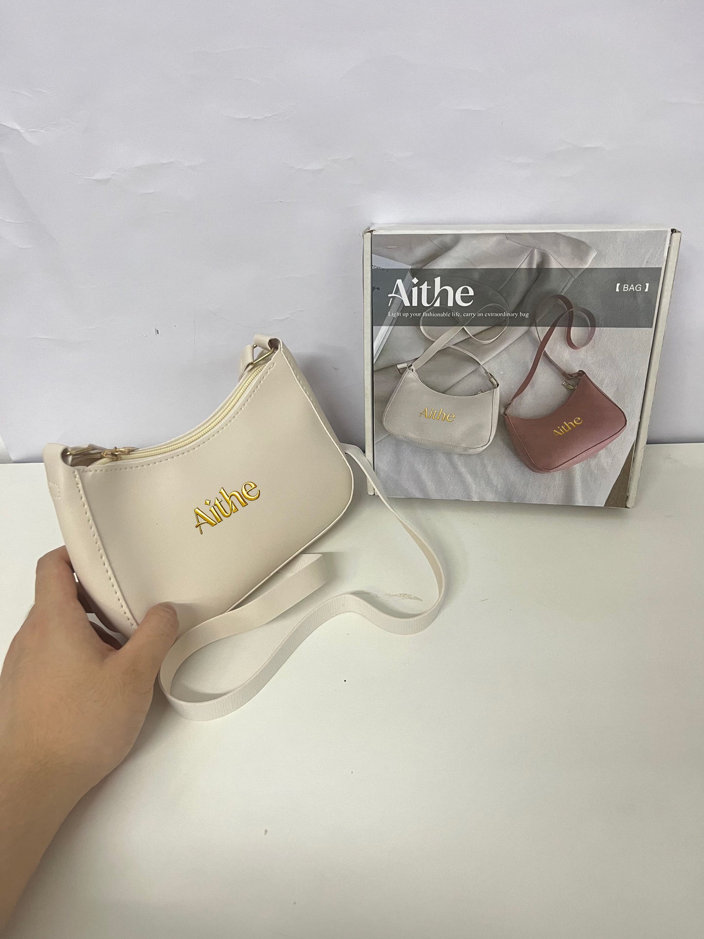 Aithe Ladies' Handbag - Beige with Gold Branding for Fashion-Forward Elegance