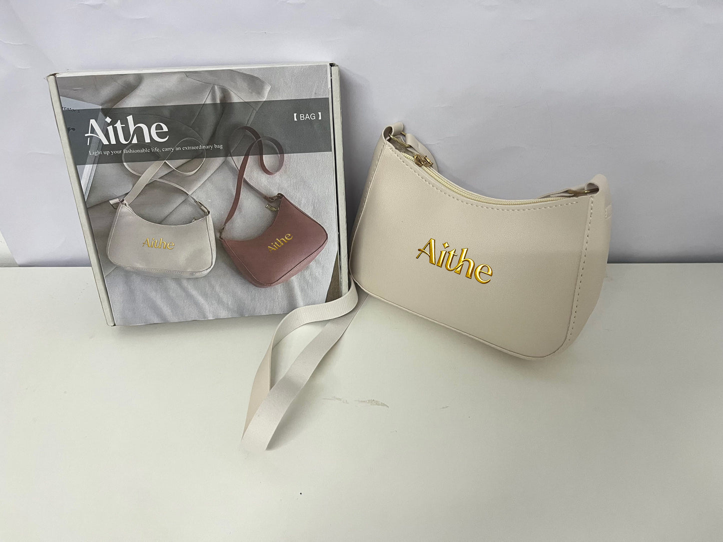 Aithe Ladies' Handbag - Beige with Gold Branding for Fashion-Forward Elegance