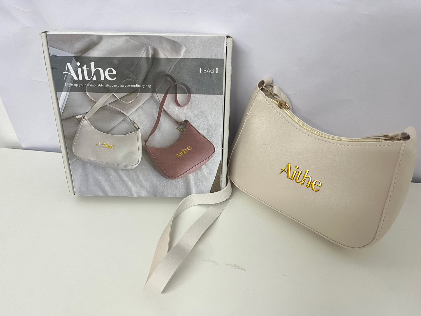 Aithe Ladies' Handbag - Beige with Gold Branding for Fashion-Forward Elegance