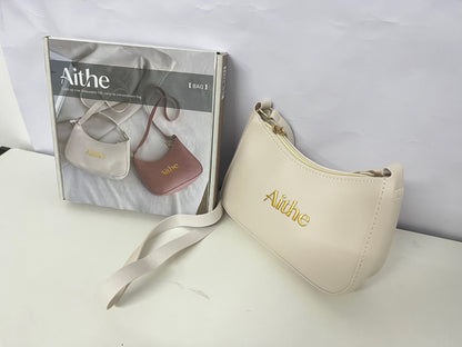 Aithe Ladies' Handbag - Beige with Gold Branding for Fashion-Forward Elegance