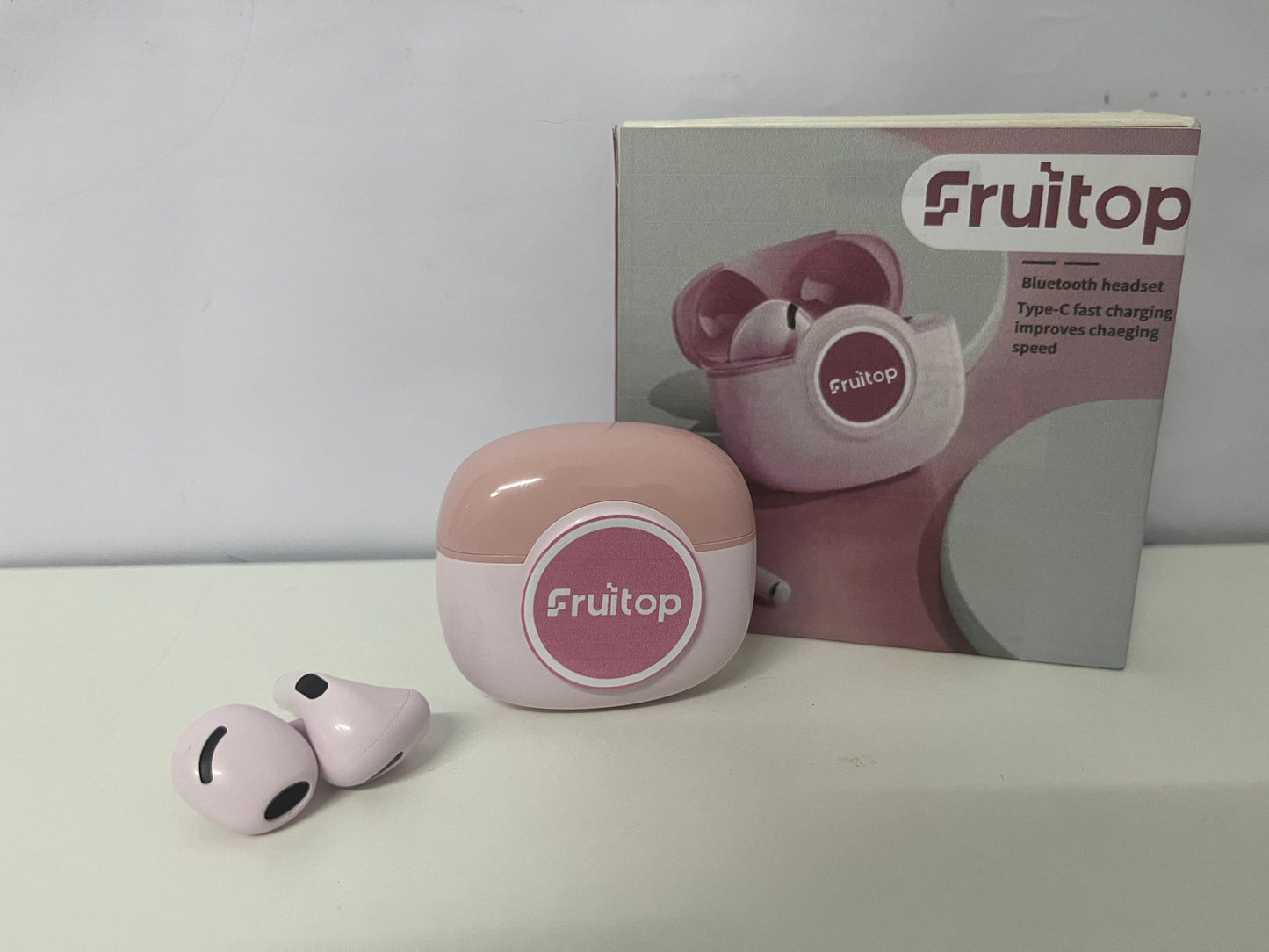 Fruitop Soft Pink True Wireless Bluetooth Headphones A Stylish & Fast-Charging Audio-Visual Essential