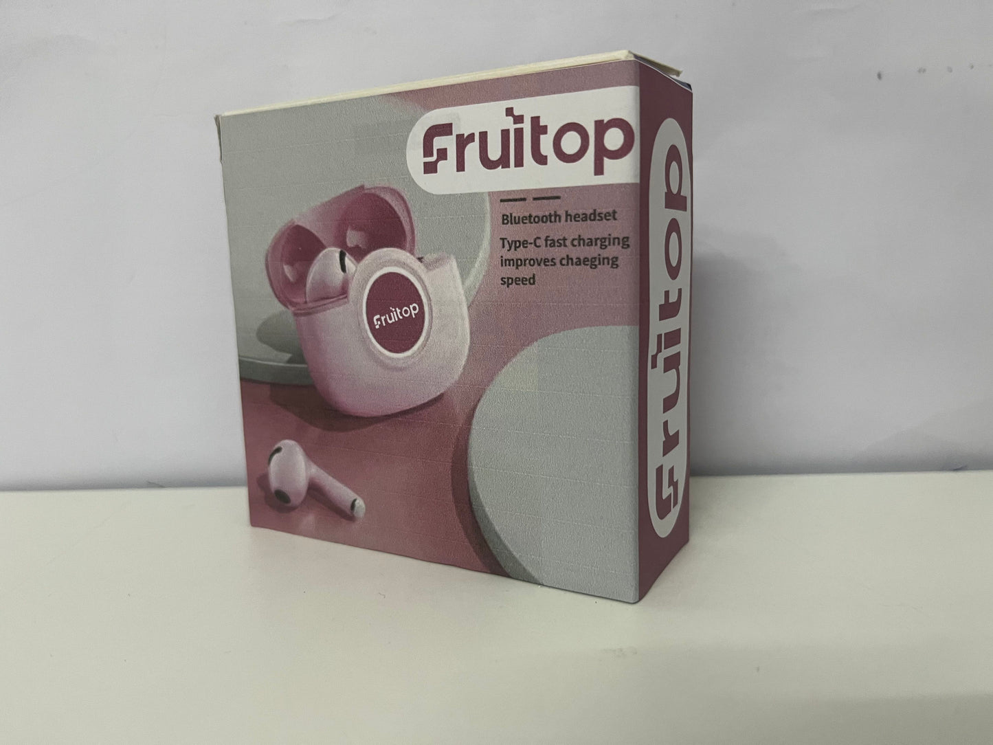 Fruitop Soft Pink True Wireless Bluetooth Headphones A Stylish & Fast-Charging Audio-Visual Essential