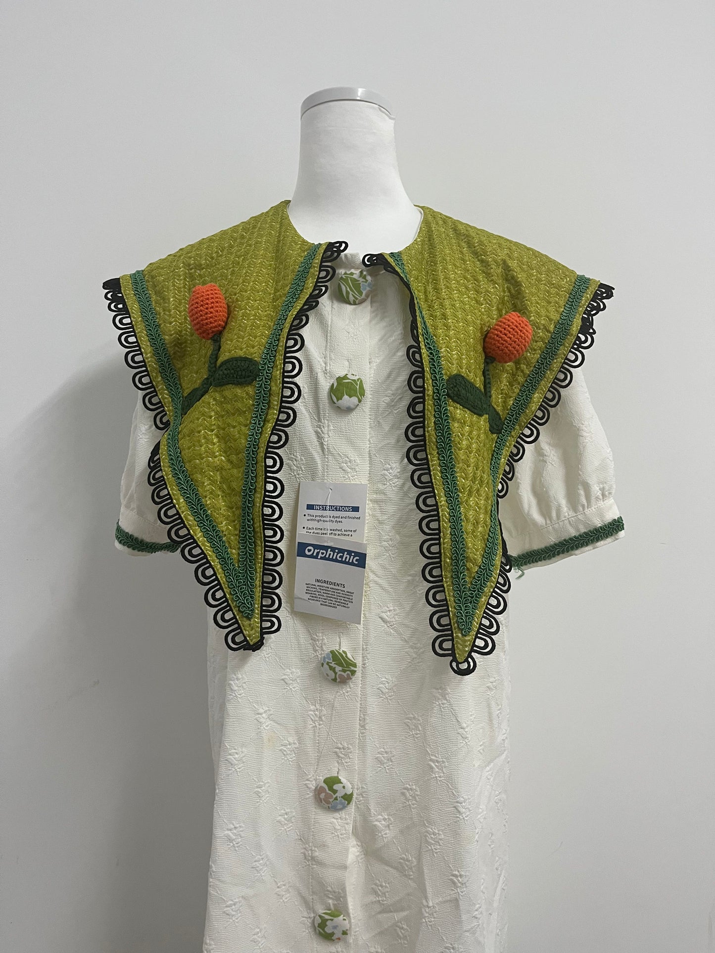 Orphichic Charming White Dress with Green Embellished Capelet
