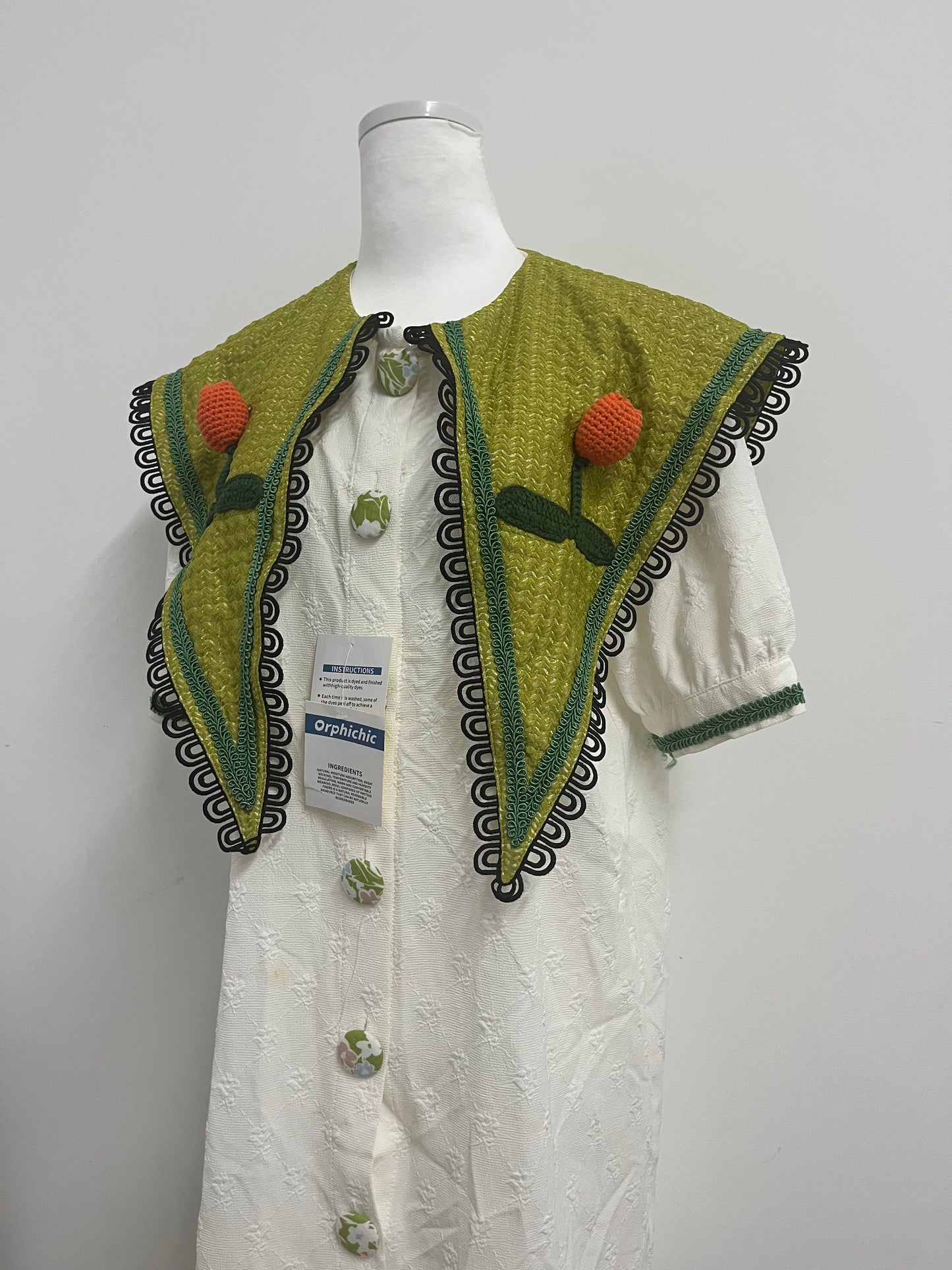 Orphichic Charming White Dress with Green Embellished Capelet