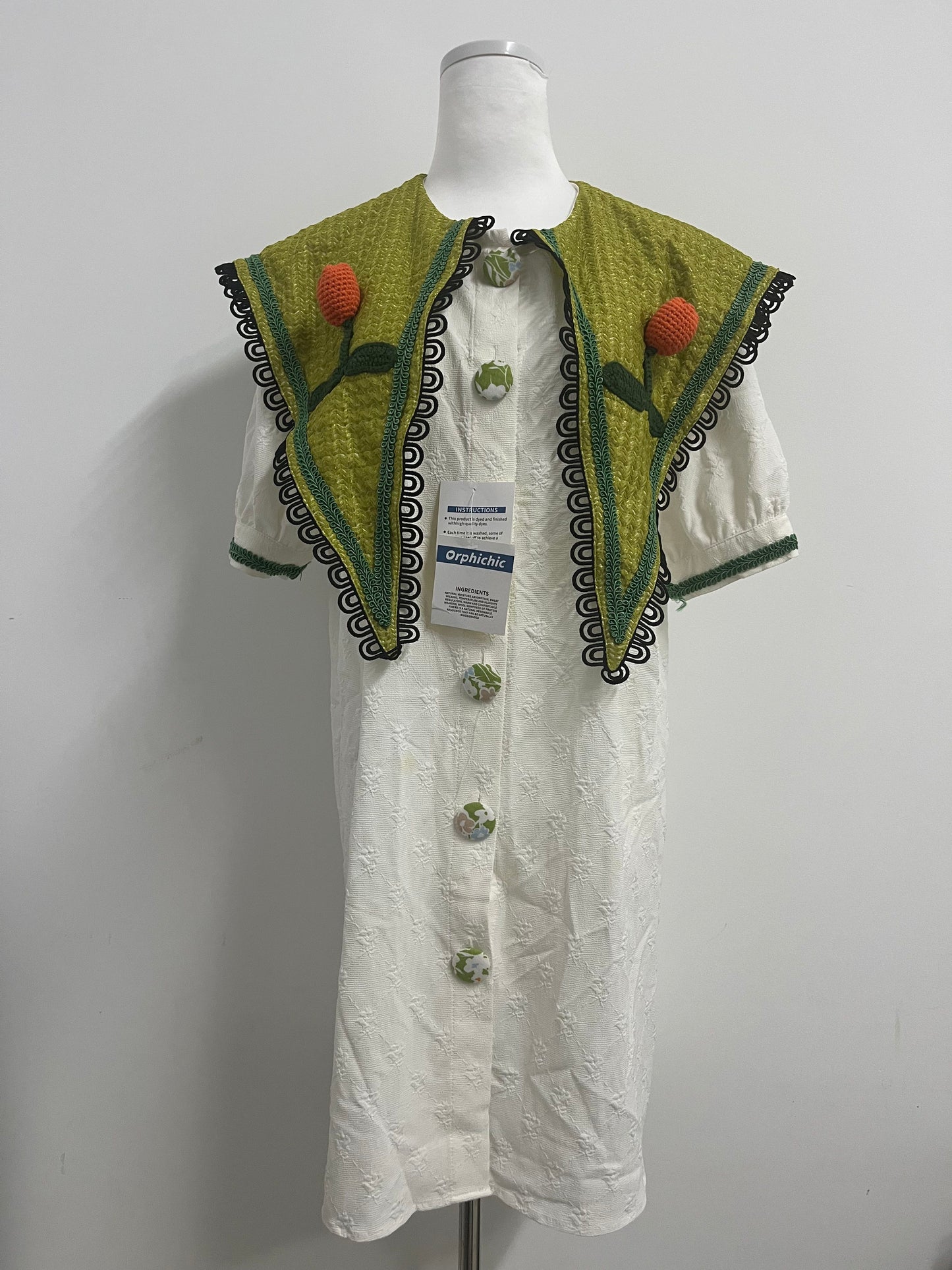 Orphichic Charming White Dress with Green Embellished Capelet